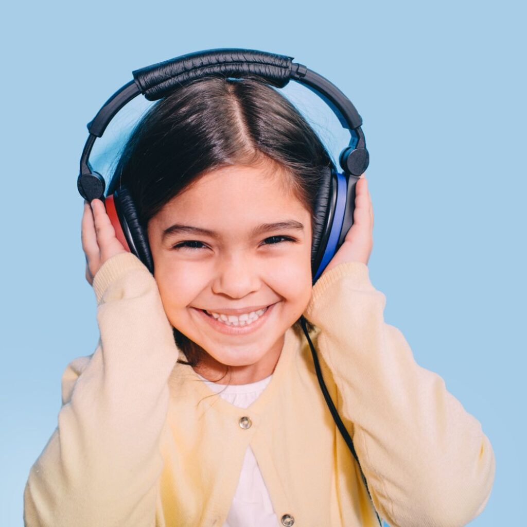 young girl headphones smiling