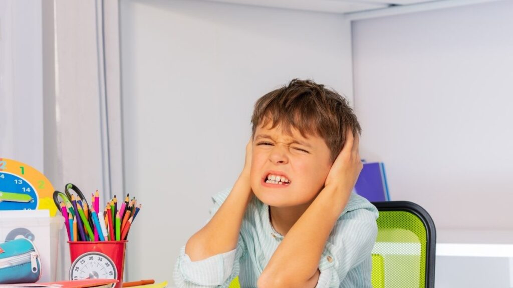 Young boy with pain in his ears